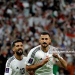 Iraq's forward #18 Aymen Hussein celebrates with teammate midfielder #13 Bashar Resan after scoring his team's third goal during the Qatar 2023 AFC Asian Cup Group D football match between Indonesia and Iraq at the Ahmad bin Ali Stadium in Al-Rayyan, west of Doha on January 15, 2024. (Photo by KARIM JAAFAR / AFP) (Photo by KARIM JAAFAR/AFP via Getty Images)